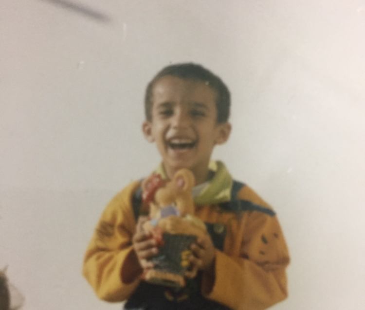 Childhood portrait holding a small figurine