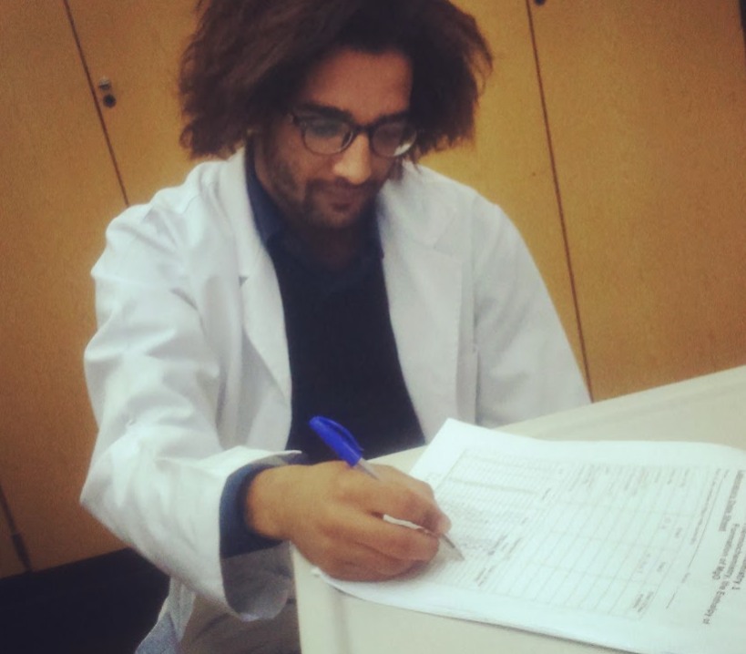A university-era photograph in a lab coat