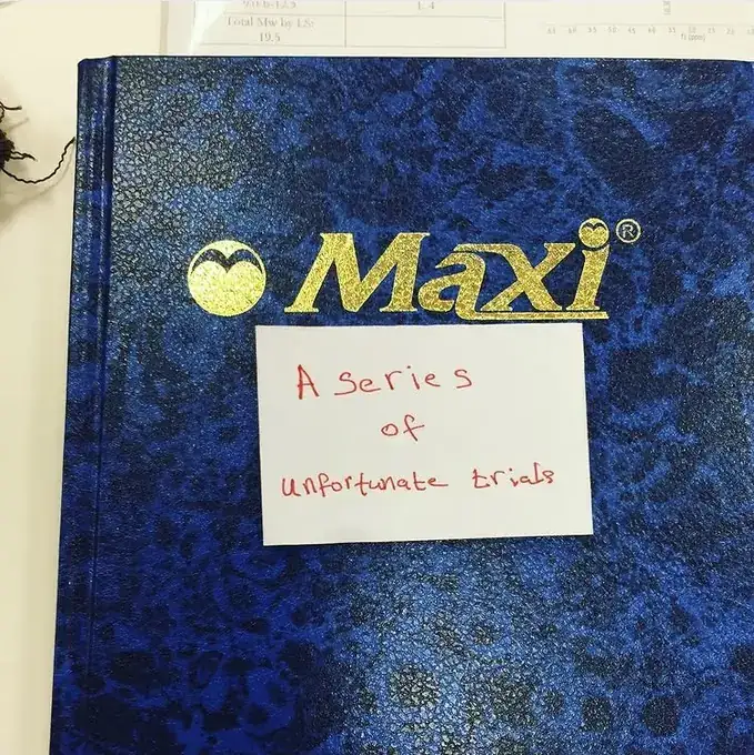 Original blue notebook with the handwritten label A series of unfortunate trials